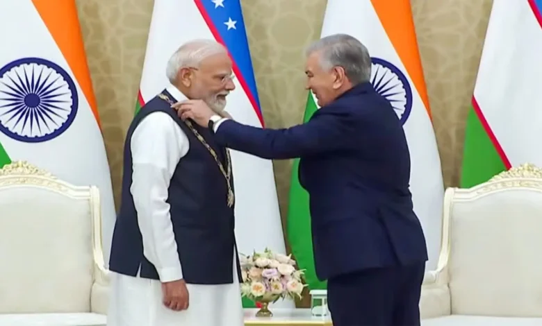 PM Modi receiving Uzbekistan’s highest state honour from President Shavkat Mirziyoyev
