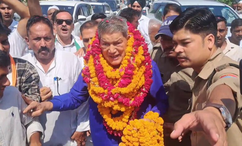 Harish Rawat during Thank You Dialogue Yatra in Haridwar with Tiger Is Back poster
